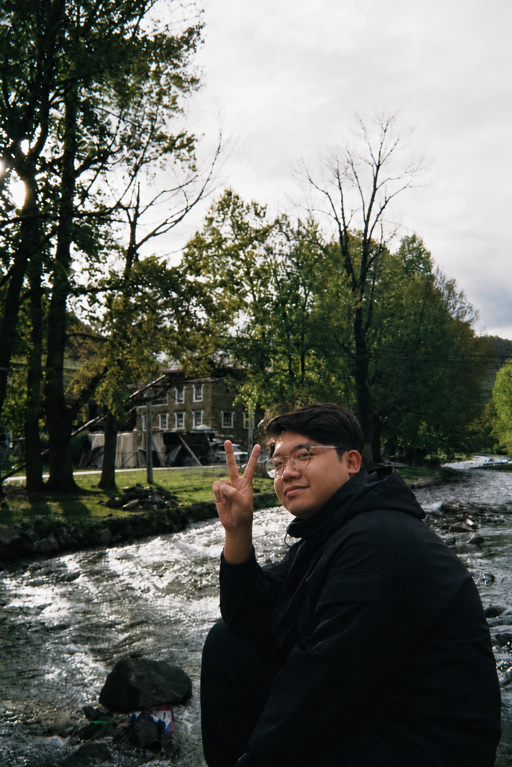 Portrait of Xiao Cao near a riverside